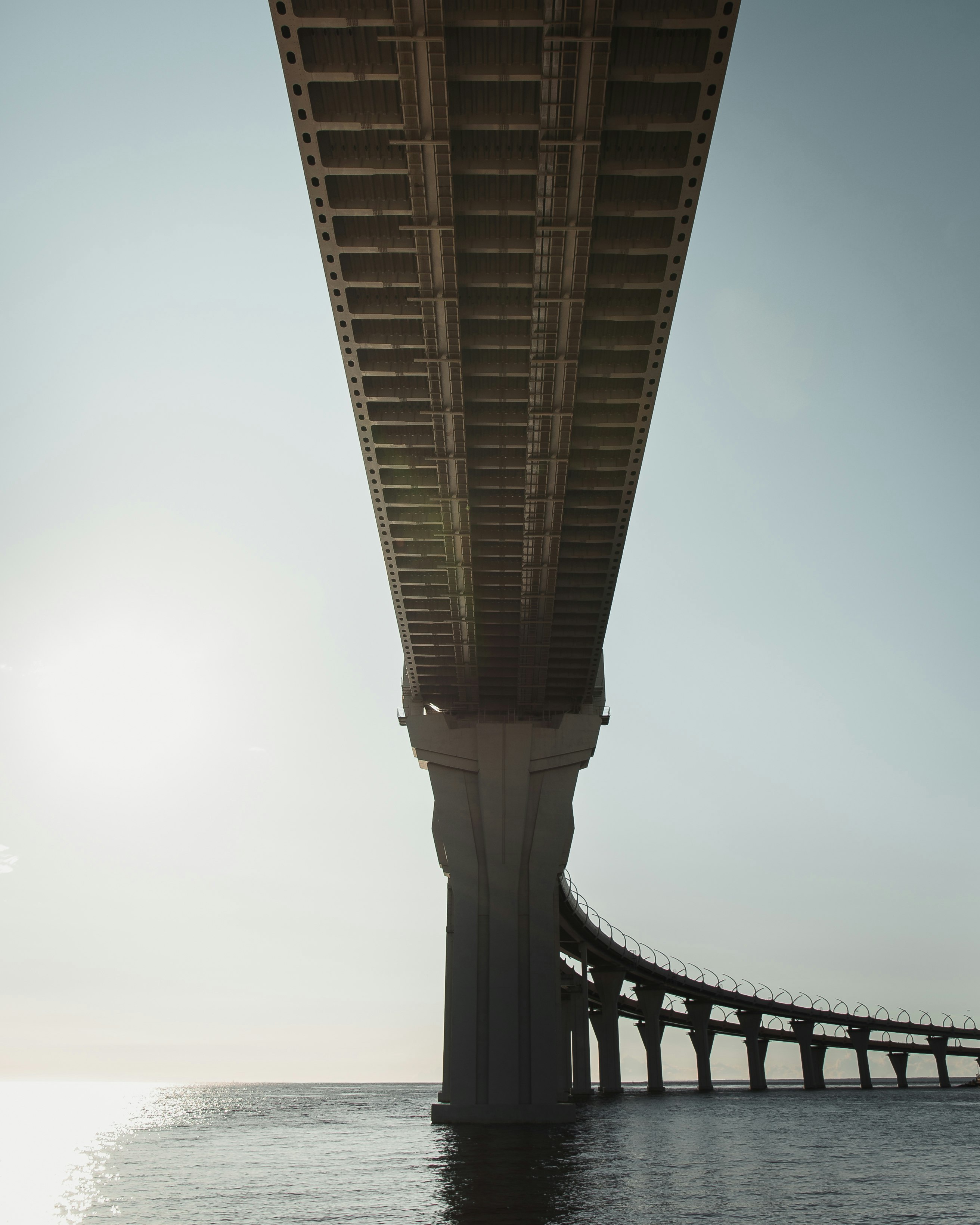 gray concrete bridge under white sky during daytime